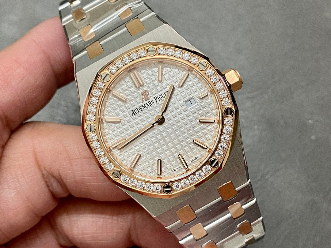 Audemars Piguet watch close-up with white dial, gold markers, and diamond-set bezel