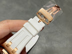 White rubber watch strap with rose-gold buckle clasp