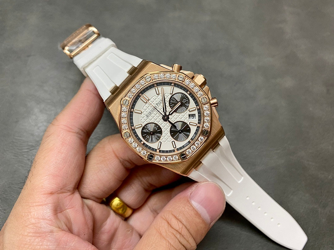Audemars Piguet chronograph watch with diamond bezel, white rubber strap, three-quarter view