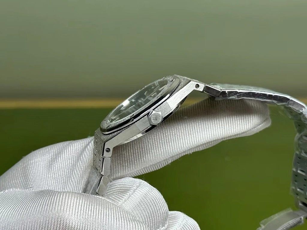 Silver-tone steel watch with side profile and black dial, held on wrist