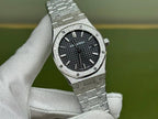 Silver-tone steel watch close-up with black dial, date window, and bezel screws