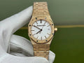 Audemars Piguet gold-toned wristwatch with white dial and textured bracelet