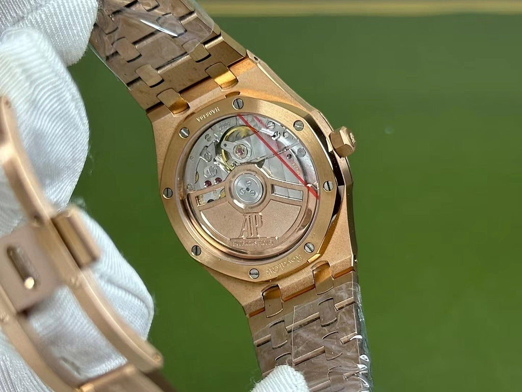 Audemars Piguet gold-toned watch case with visible mechanical movement
