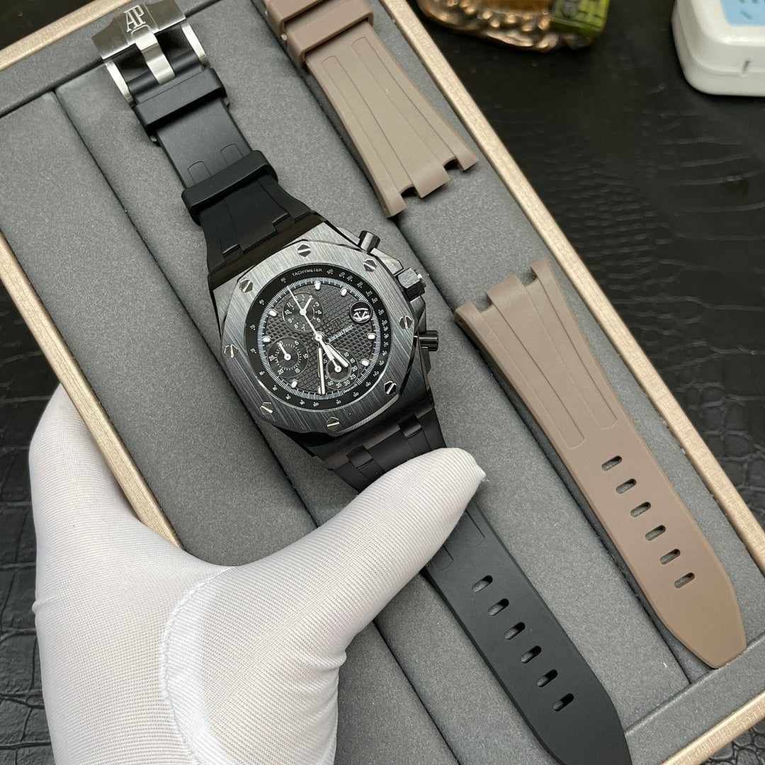 Audemars Piguet Royal Oak chronograph watch on black rubber strap, spare strap included