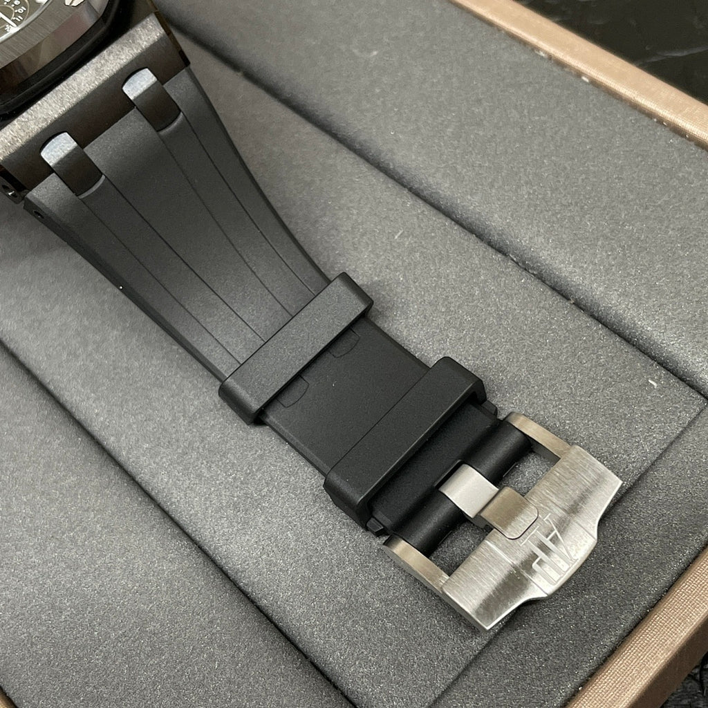 Audemars Piguet Royal Oak watch with black rubber strap and metal buckle