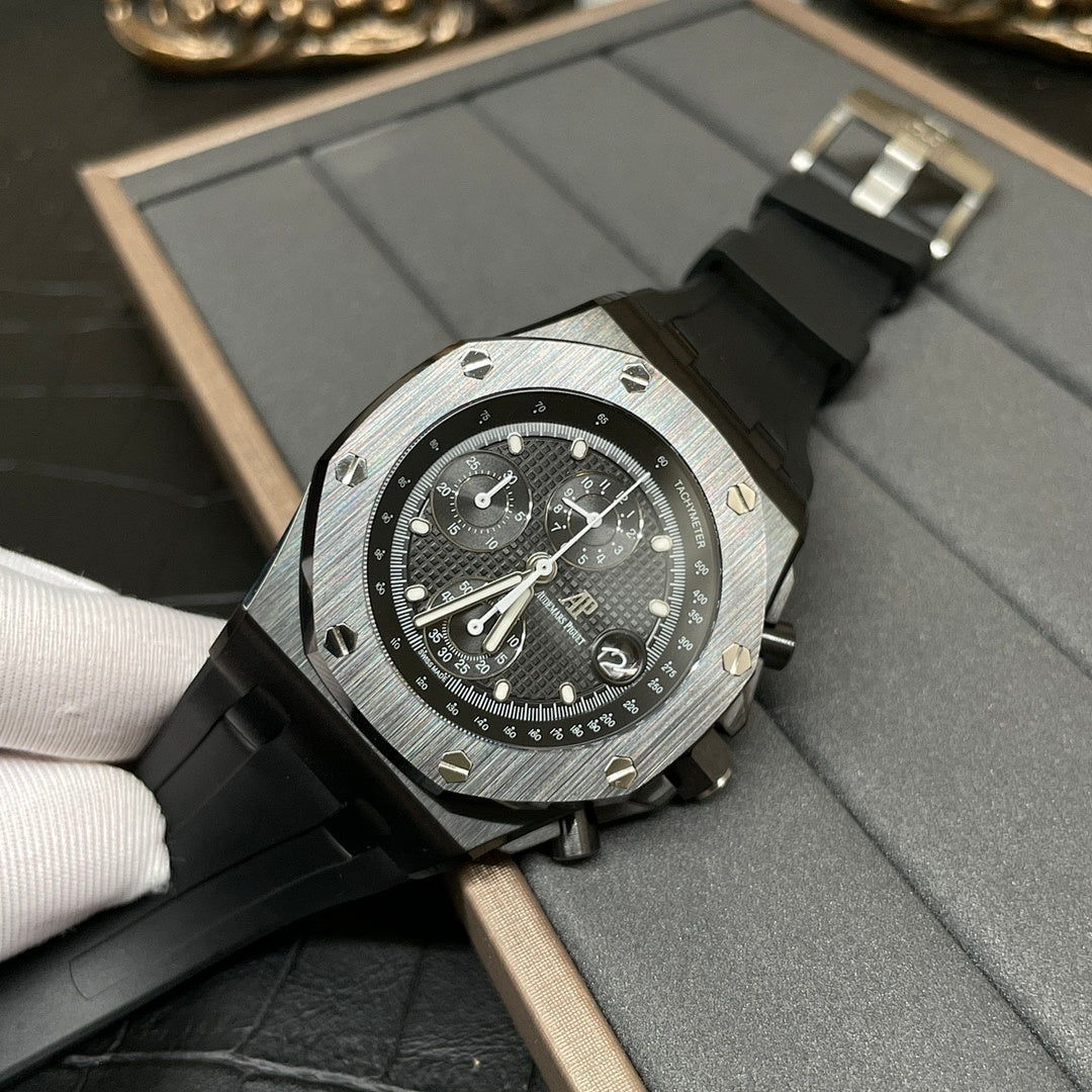 Audemars Piguet Royal Oak chronograph watch with black dial and black rubber strap