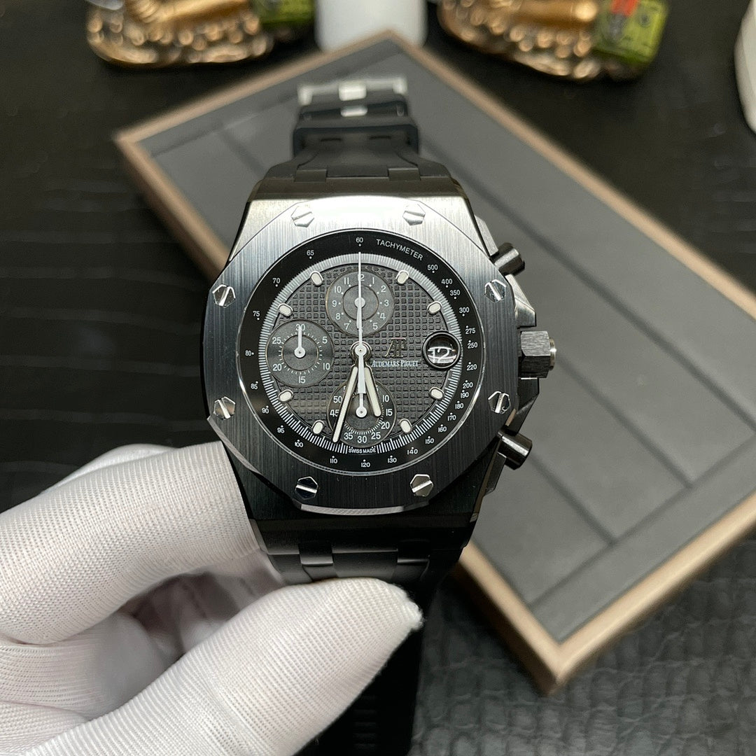 Audemars Piguet Royal Oak chronograph watch with black dial and black rubber strap