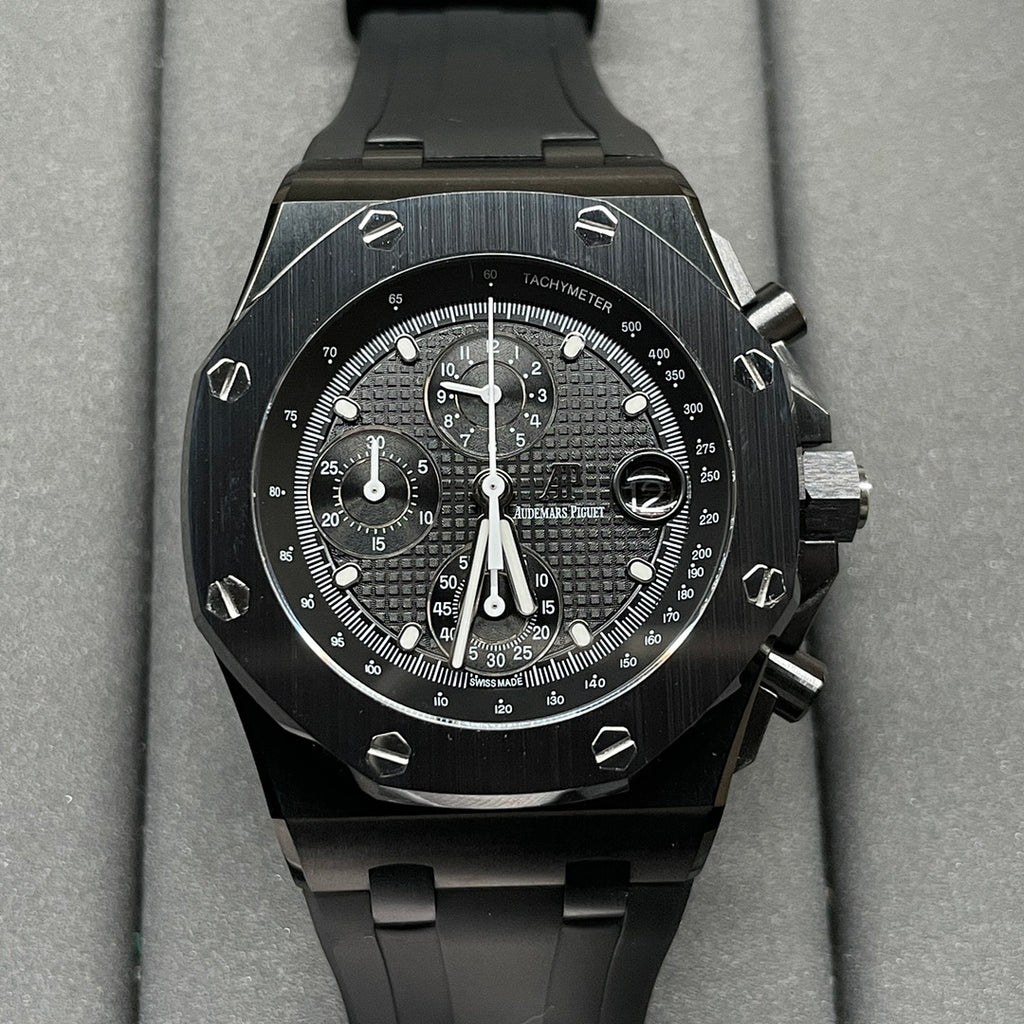 Audemars Piguet Royal Oak chronograph watch with black dial and black rubber strap