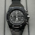 Audemars Piguet Royal Oak chronograph watch with black dial and black rubber strap