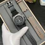 Audemars Piguet Royal Oak chronograph watch on black rubber strap, paired with beige strap