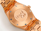 Audemars Piguet rose gold case with engraved caseback medallion and metal bracelet.