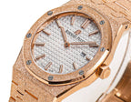 Audemars Piguet rose gold watch with white textured dial, applied indices, and crown at 3.