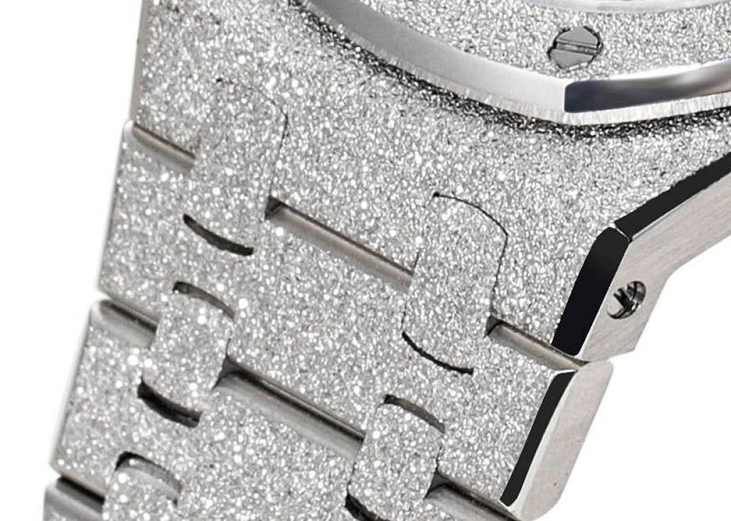 Audemars Piguet stainless steel crown area with textured panel and engraved markers
