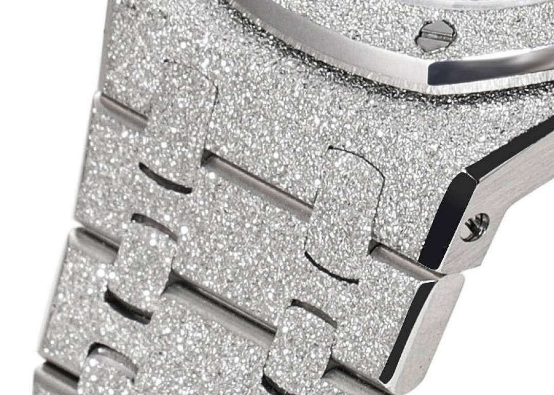 Audemars Piguet stainless steel crown area with textured panel and engraved markers
