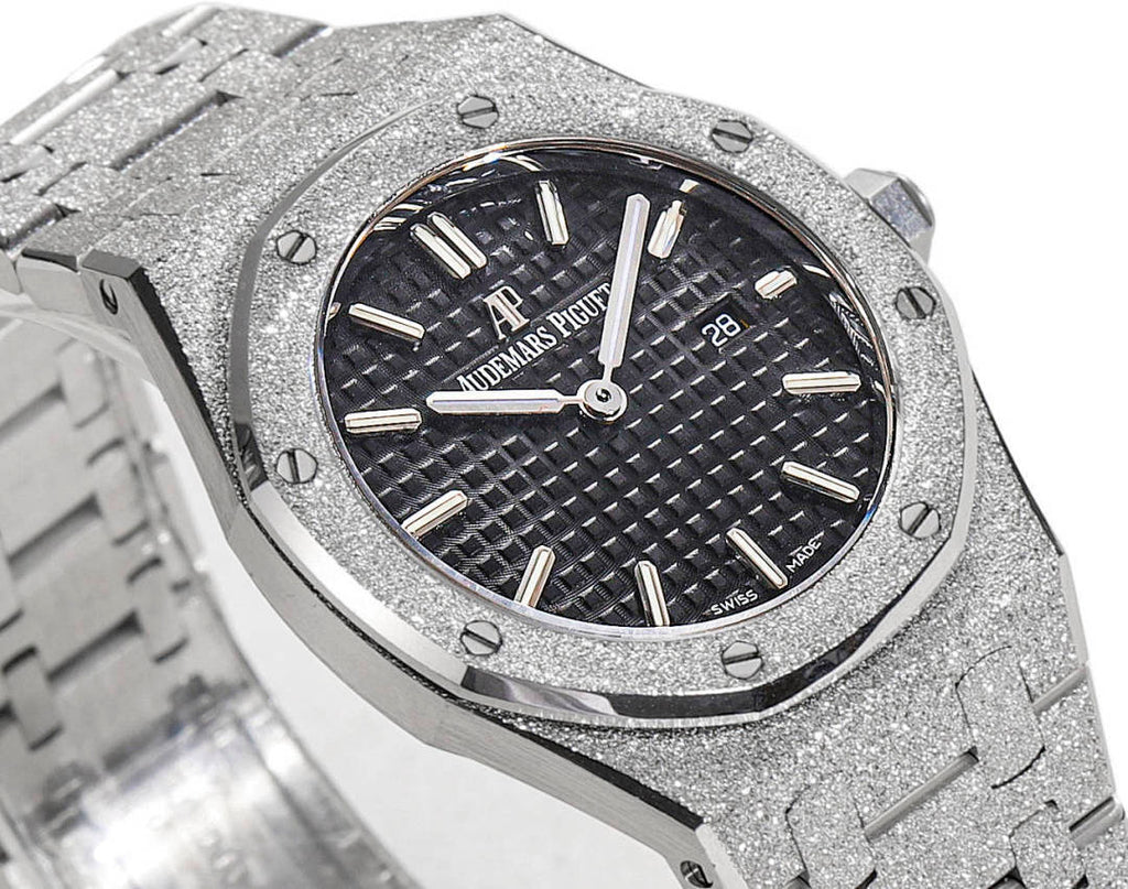 Audemars Piguet stainless steel watch with textured dark dial and baton hour markers
