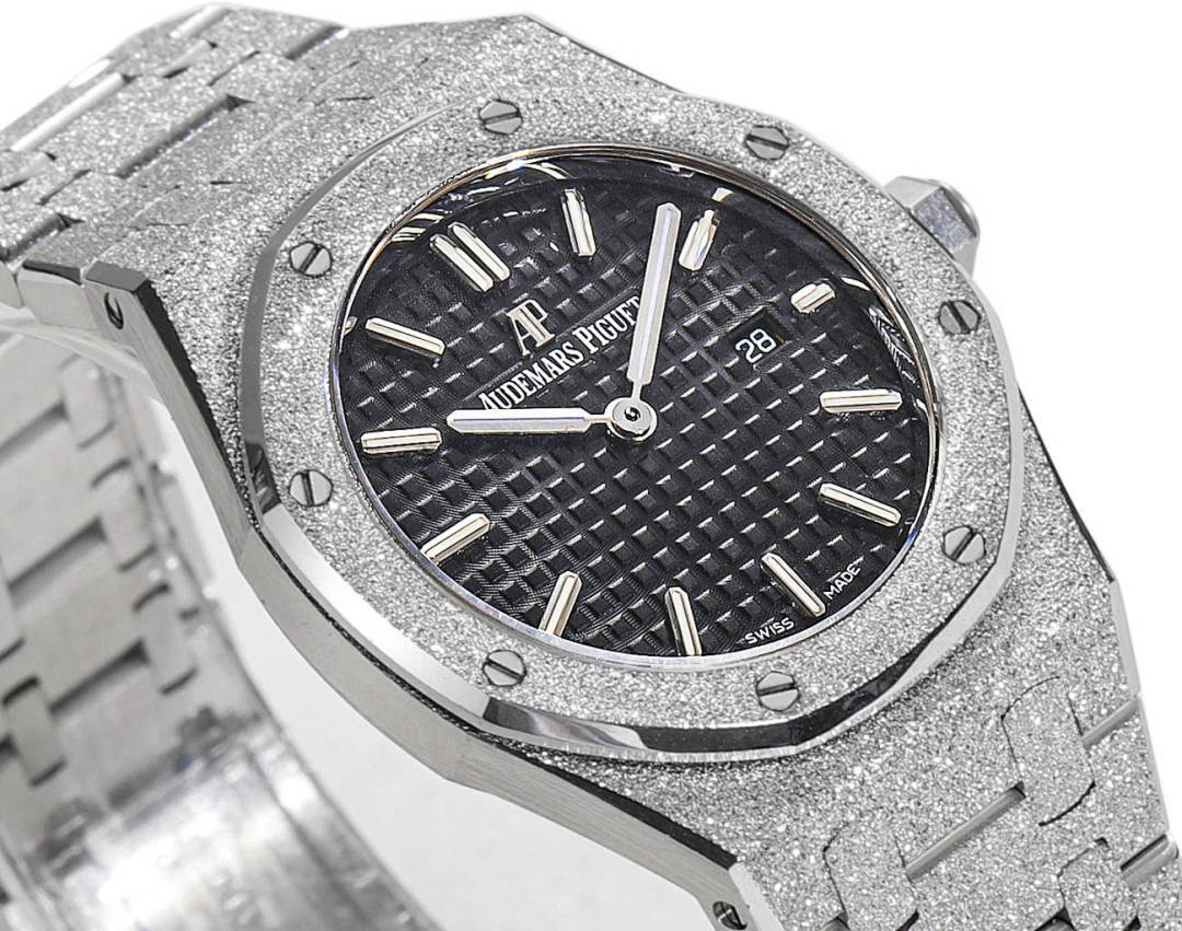 Audemars Piguet stainless steel watch with textured dark dial and baton hour markers