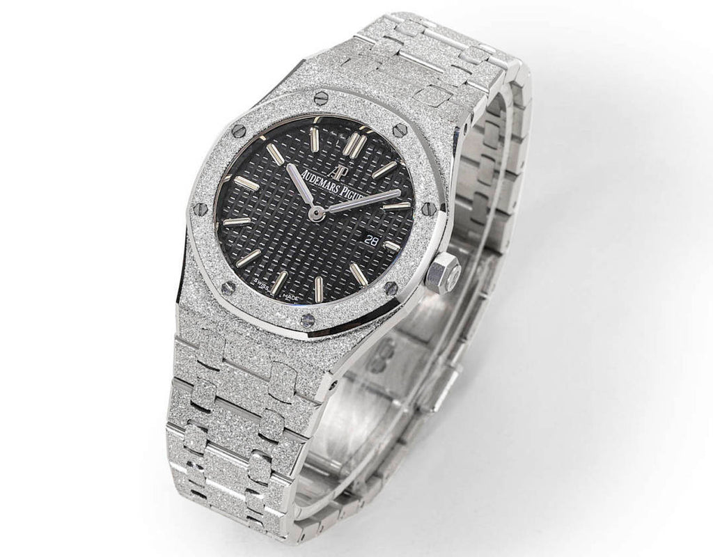Audemars Piguet stainless steel watch with dark dial and textured link bracelet