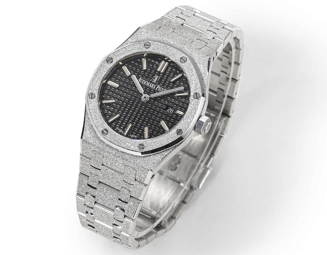 Audemars Piguet stainless steel watch with dark dial and textured link bracelet