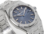 Silver watch with blue patterned dial, baton hour markers, and hands
