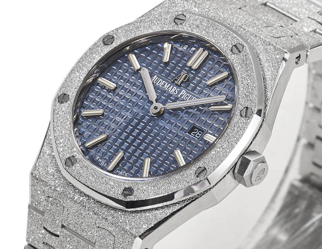 Silver watch with blue dial, baton markers, and date window