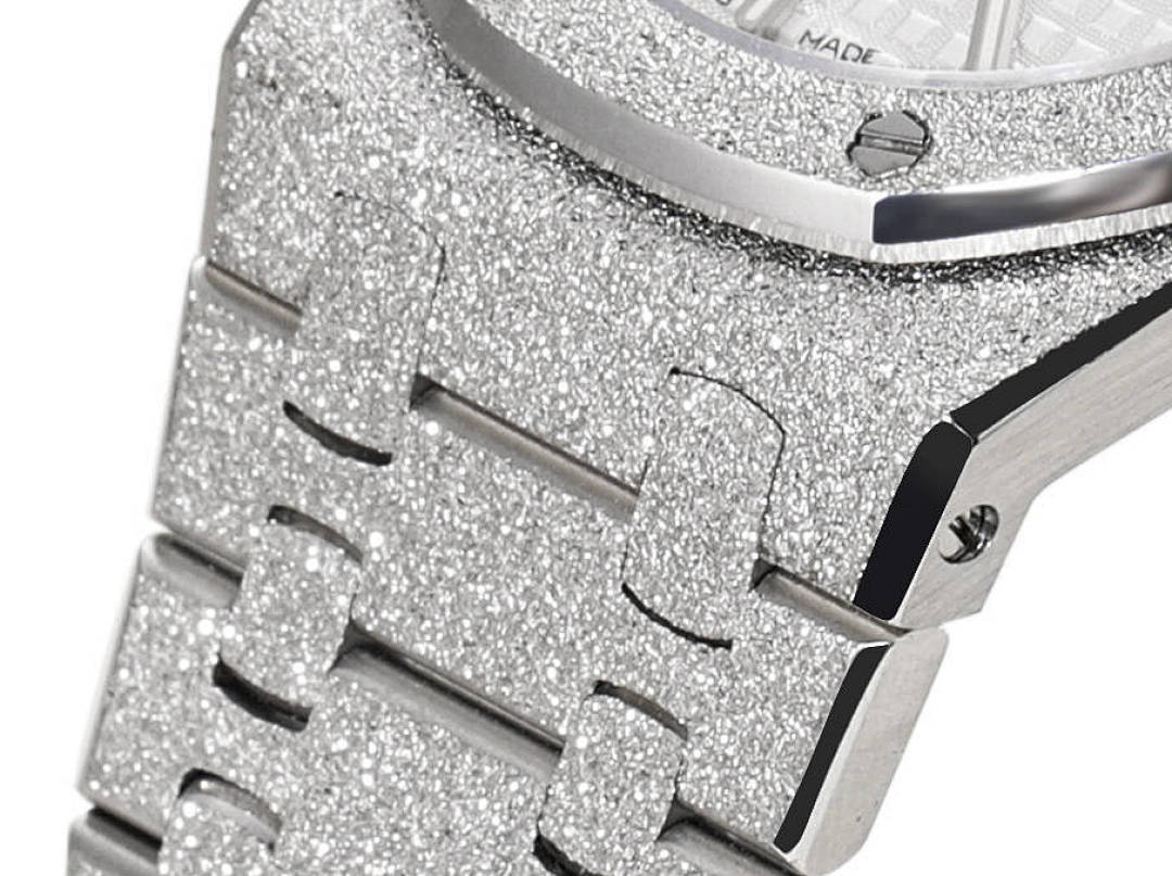 Audemars Piguet watch dial close-up with glittery bezel, hour markers and hands