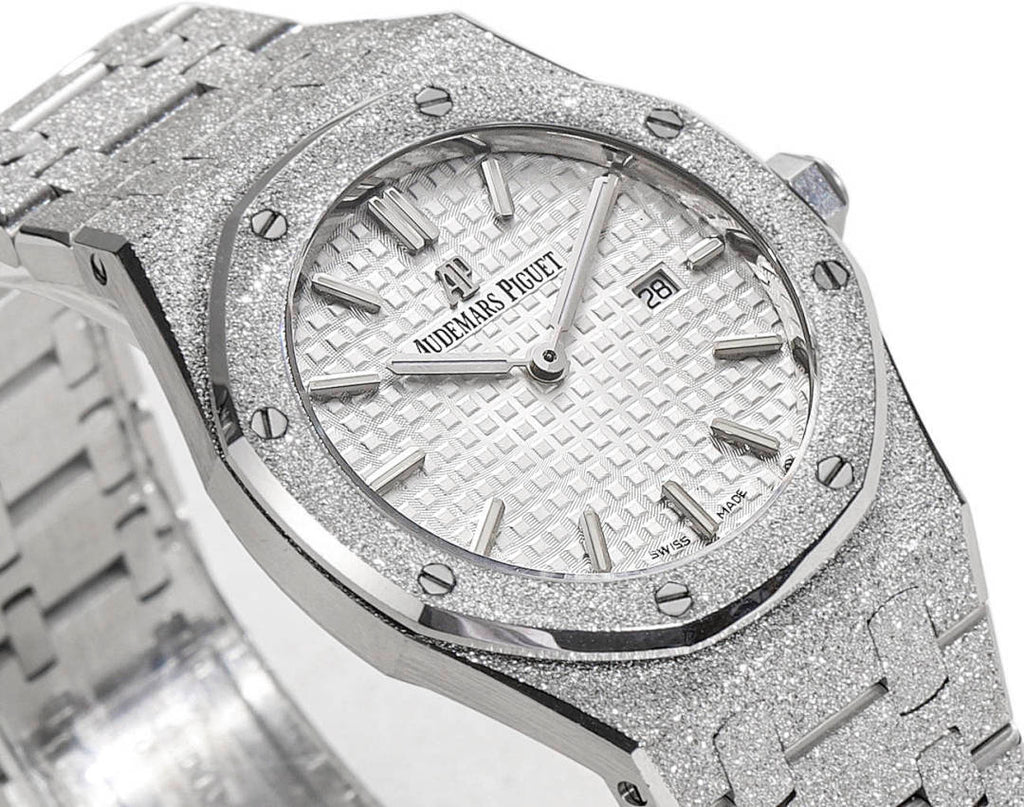 Audemars Piguet watch with white textured dial, baton markers, metal bezel