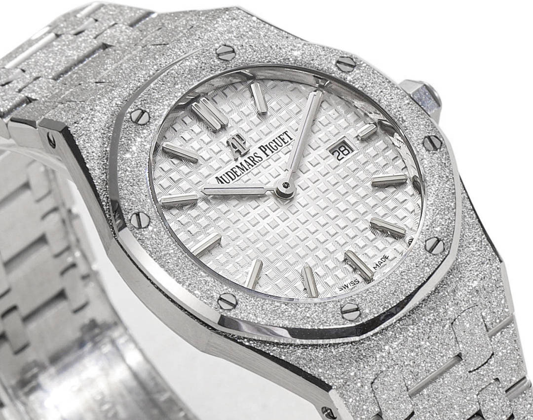 Audemars Piguet watch with white textured dial, baton markers, metal bezel