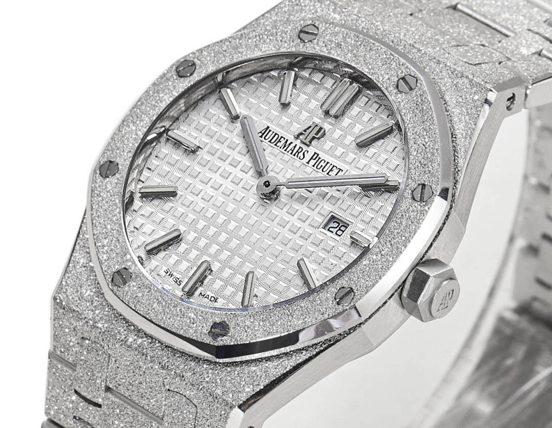 Audemars Piguet watch front with date window at 28, textured dial, steel bracelet