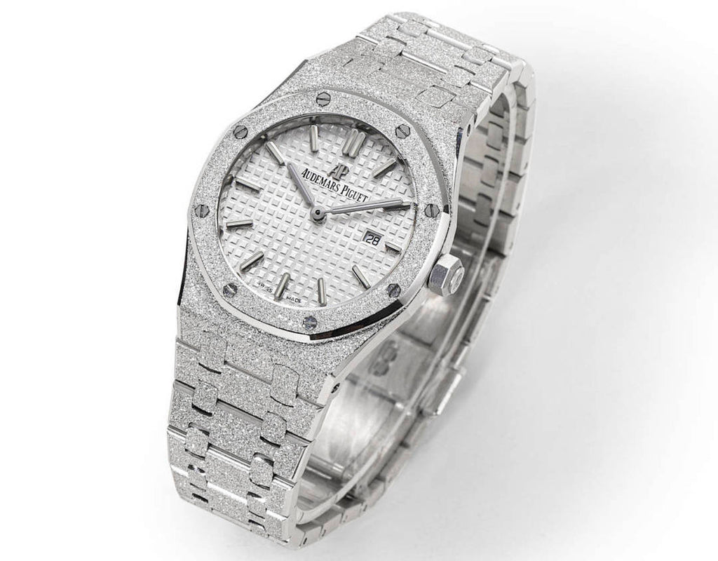 Audemars Piguet steel watch with textured white dial and linked bracelet, side view