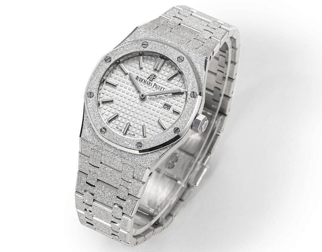 Audemars Piguet steel watch with textured white dial and linked bracelet, side view