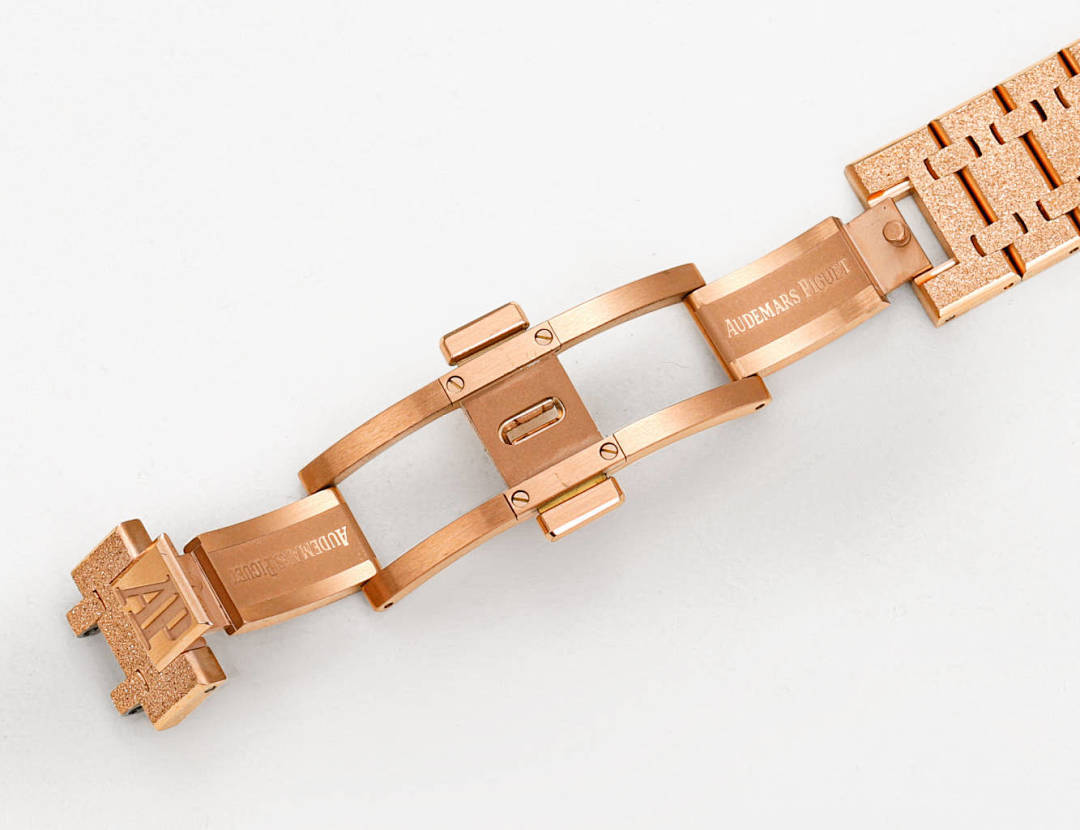 Audemars Piguet watch, rose-gold metal bracelet with link clasp, side profile