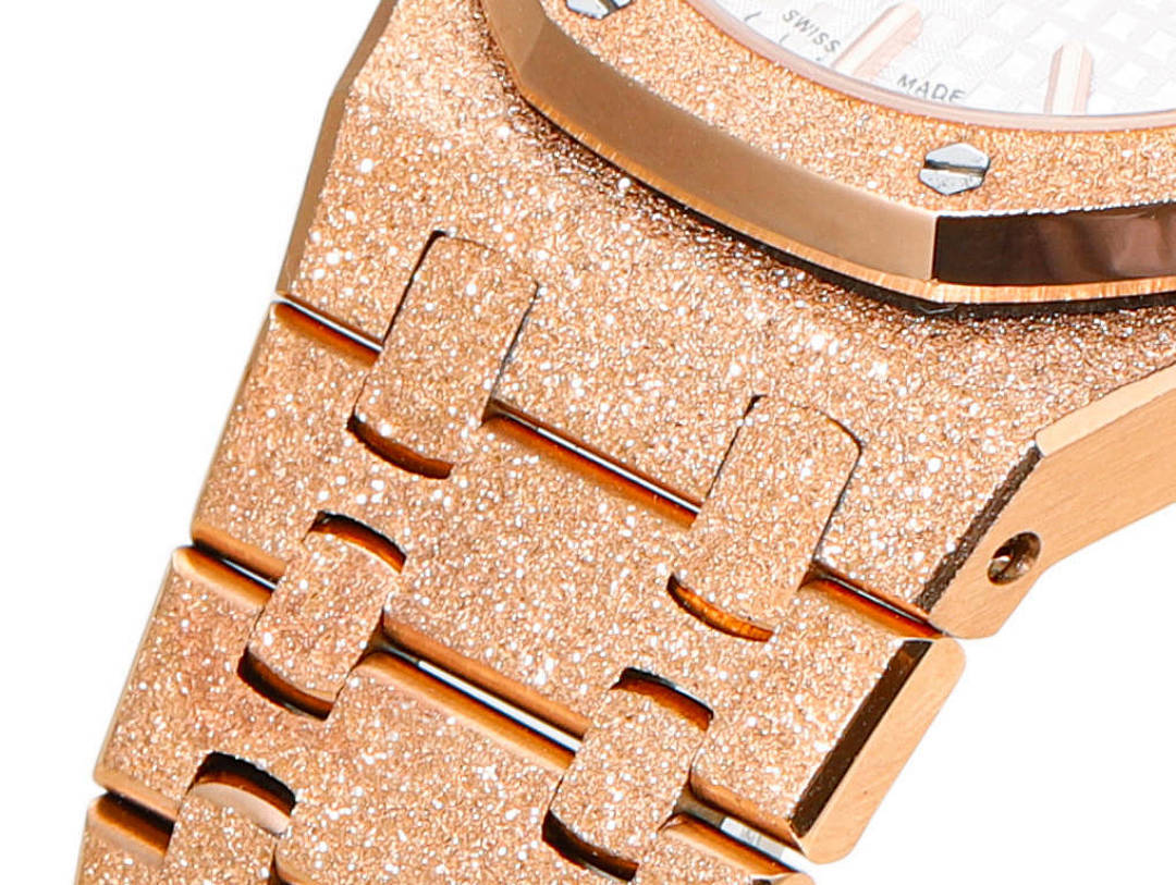 Audemars Piguet watch link detail in rose-gold with textured finishing