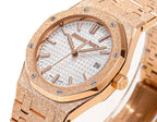 Audemars Piguet watch close-up of white dial, rose-gold markers and date window