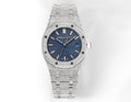 Luxury wristwatch with blue textured dial, silver steel case, and matching link bracelet.