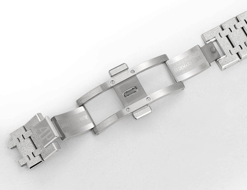Silver steel watch bracelet links shown from the side, with clasp hardware.