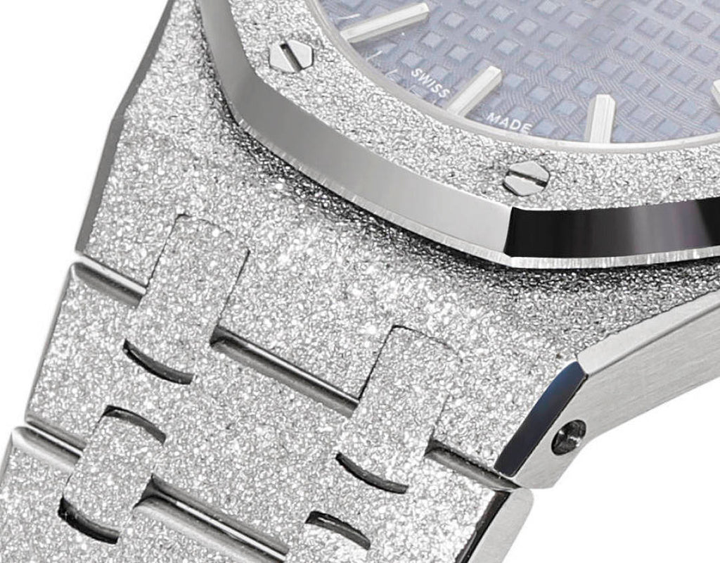 Glitter-textured silver bezel and case with blue dial edge visible near the crown.