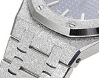 Glitter-textured silver bezel and case with blue dial edge visible near the crown.