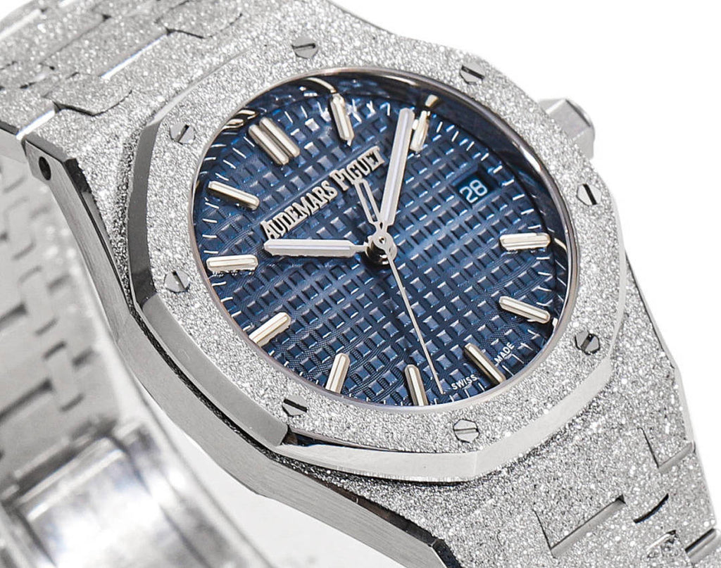 Blue textured dial wristwatch with gold-tone hour markers and hands on a steel case.