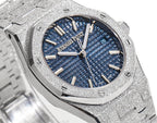 Blue textured dial wristwatch with gold-tone hour markers and hands on a steel case.