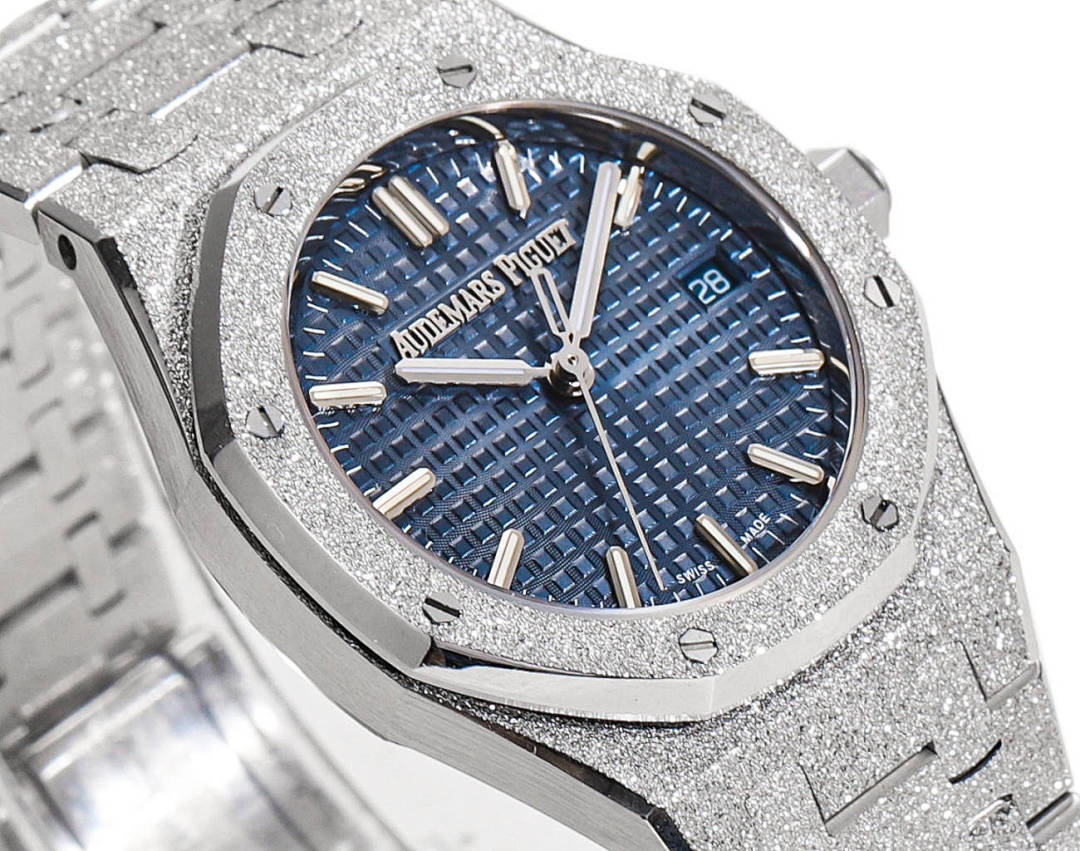 Blue textured dial wristwatch with gold-tone hour markers and hands on a steel case.
