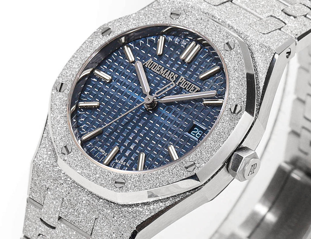 Blue textured dial wristwatch with three hands, gold-tone markers, and steel bracelet.