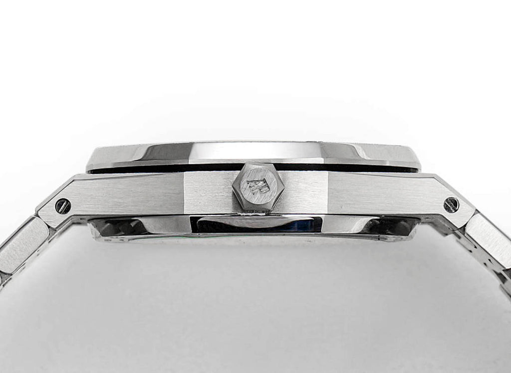 Audemars Piguet watch case top view with crown and faceted bezel