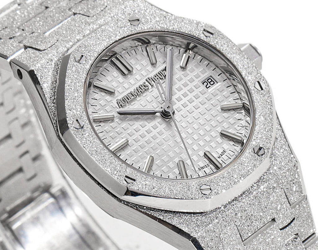 Audemars Piguet watch face with textured silver dial and baton hour markers