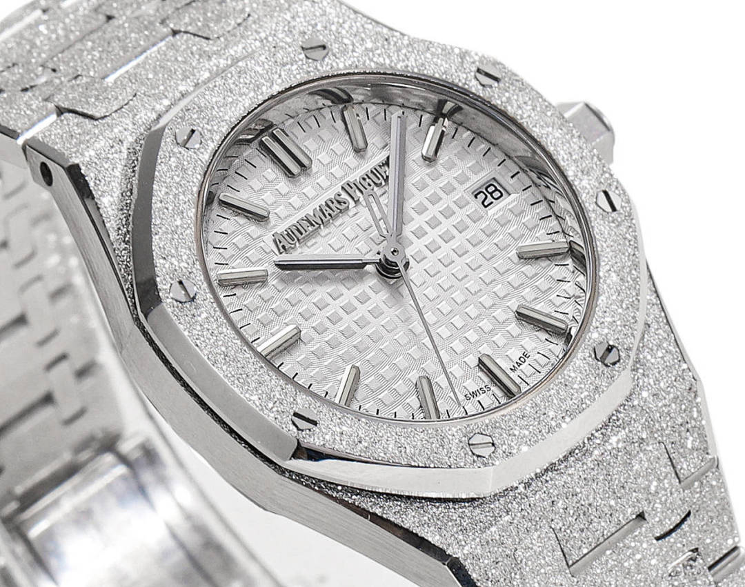 Audemars Piguet watch face with textured silver dial and baton hour markers
