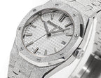 Audemars Piguet watch face with textured silver dial, baton hands, and date at 28