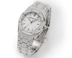 Audemars Piguet watch showing white dial, textured bezel, and silver bracelet
