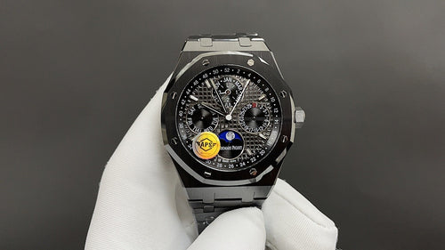 Audemars Piguet watch with black dial, chronograph subdials, and steel bracelet