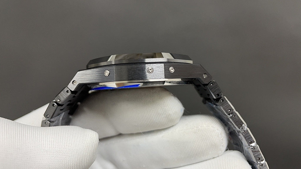 Audemars Piguet watch side profile with blue accents on bezel, steel links