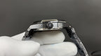 Audemars Piguet watch with crown and pushers on dark bezel, steel bracelet