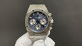 Audemars Piguet Royal Oak watch with blue dial, steel case, and chronograph subdials